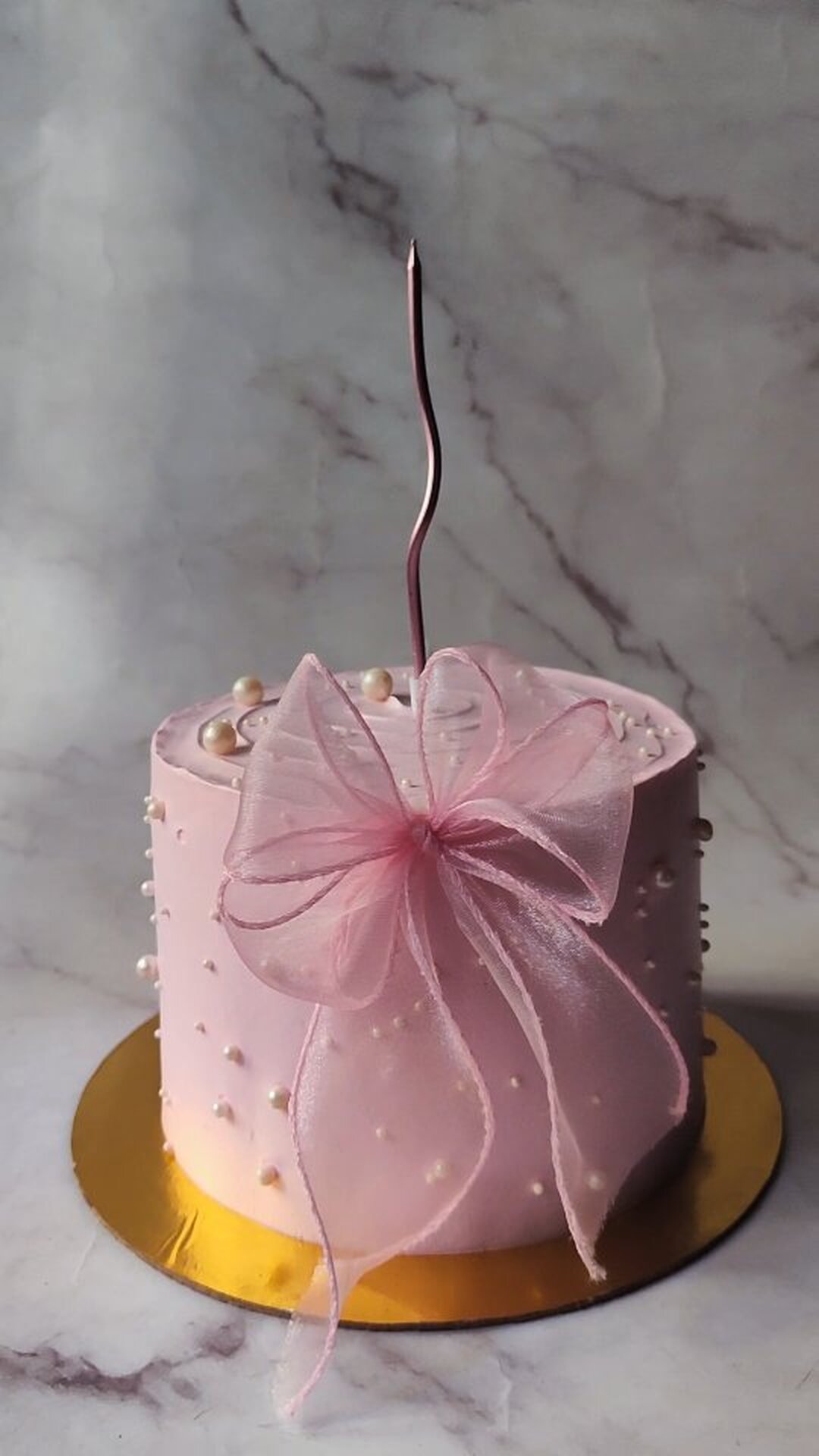 Pastel pink bow celebration cake